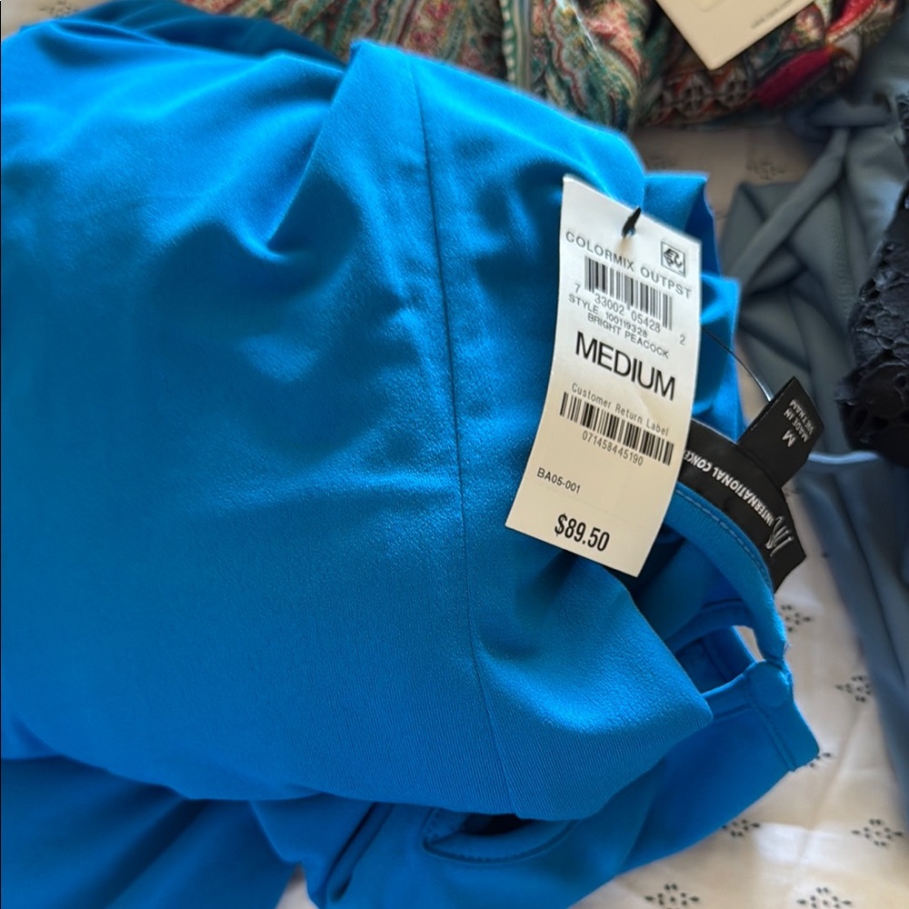 Multiple woman’s clothes all brand new more like mystery box